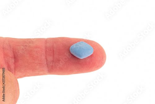 Canvastavla Blue diamond shaped pill on human finger tip