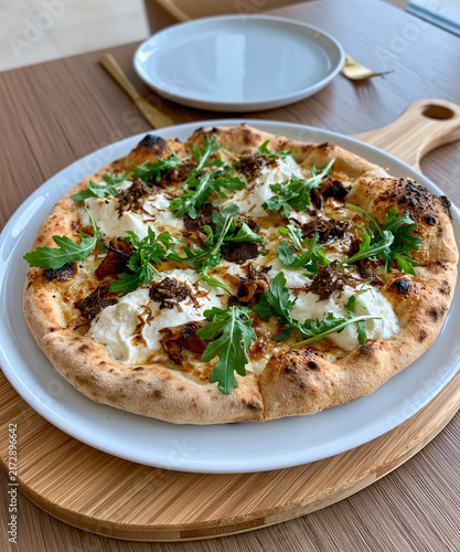 Gourmet Pizza Delight A close-up of a freshly baked gourmet pizza, adorned with creamy white cheese, savory meat crumbles, and fresh green arugula, rests on a rustic wooden board.
