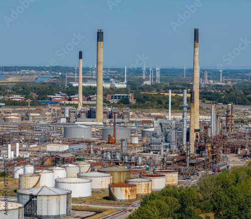 Stanlow Refinery industrial complex in Ellesmere Port, Cheshire, showing extensive pipework, storage tanks and chimneys used in oil and fuel production.