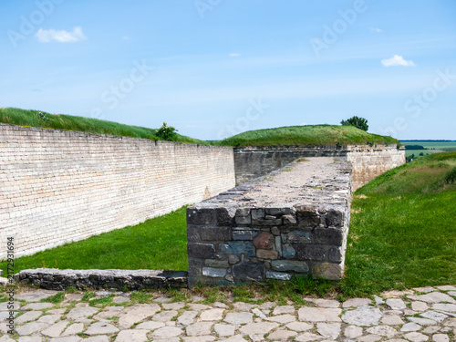 Historic Khotyn fortress walls stand strong in Khotyn Ukraine under clear sky on sunny day