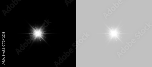Two bright white lights shine with starburst effects on a completely black background. Sharp glowing points emit rays and small sparkling particles around each light source.