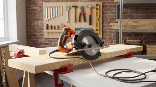 Circular saw rests on a wooden plank clamped to a workbench in a workshop.