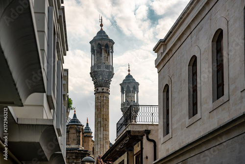 Bild auf Leinwand Aziziye Mosque minaret framed by historic Konya bazaar architecture