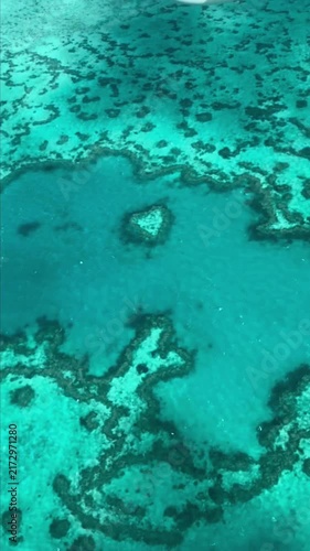 A breathtaking aerial look at Heart Reef, a naturally perfect heart‑shaped coral formation within Hardy Reef in Queensland.