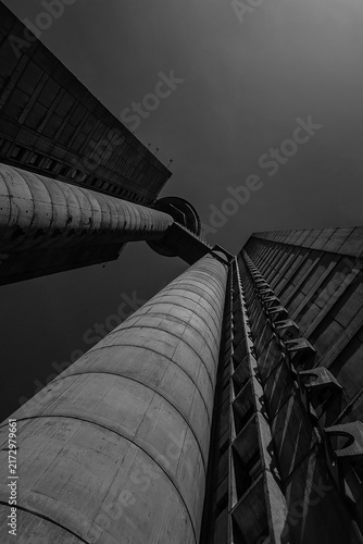 BELGRADE, SERBIA - AUGUST 24, 2026: Low angle view of the famous Genex Tower, a classic brutalist concrete skyscraper under a clear sky in New Belgrade.