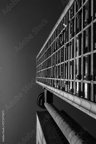 BELGRADE, SERBIA - AUGUST 24, 2026: Low angle view of the famous Genex Tower, a classic brutalist concrete skyscraper under a clear sky in New Belgrade.
