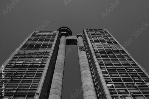 BELGRADE, SERBIA - AUGUST 24, 2026: Low angle view of the famous Genex Tower, a classic brutalist concrete skyscraper under a clear sky in New Belgrade.