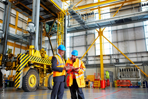 Bild auf Leinwand Tablet, team and talk with clipboard in warehouse for shipping, logistics service or safety checklist