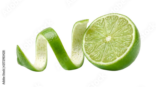 Fresh green lime half with spiral peel, organic citrus fruit for cocktails and cooking, vibrant lime zest and juicy fruit texture isolated on Transparent Background