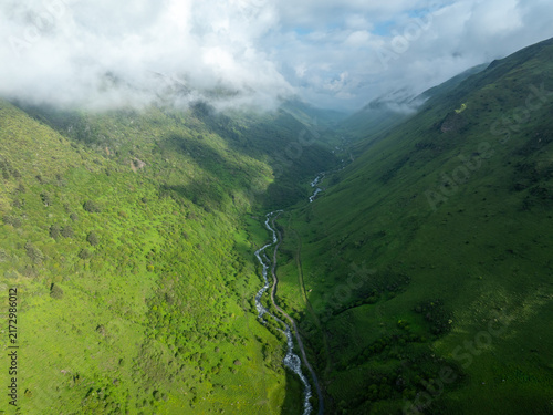 Bild auf Leinwand Aerial view of beautiful high altitude grassland and mountain landscape