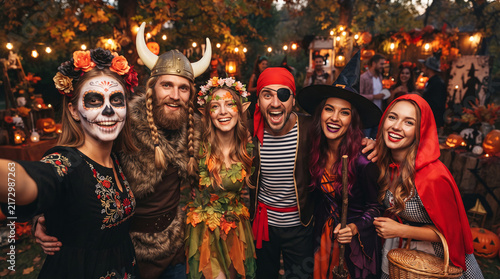A group of friends in costume  celebrating Halloween with festive decor  symbolizing community and festive fun