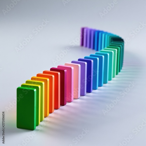 Colorful S-shaped line of upright rainbow dominoes
