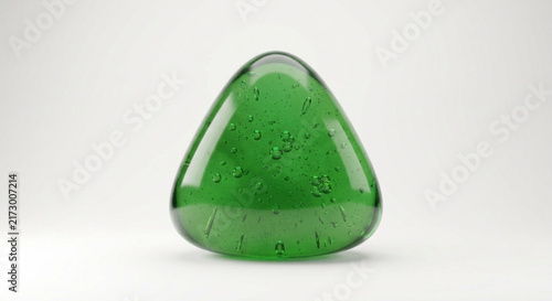 Translucent green triangular gel drop with internal air bubbles isolated on white background
