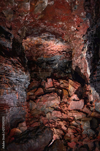 Obraz na plátně A tall column of folded black lava rises inside Raufarholshellir, Iceland