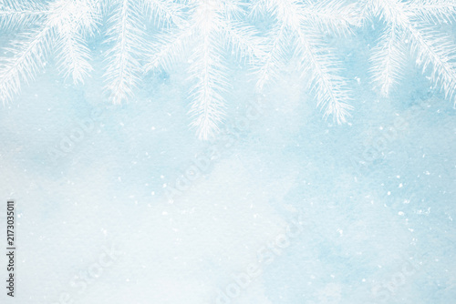 A blue watercolor background with white fir branches for creating web banners for the winter holidays.