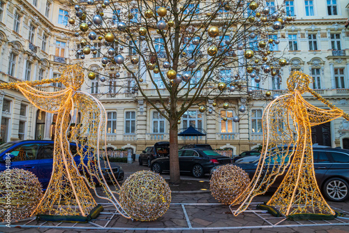 Obraz na płótnie Luxury hotel courtyard decorated for Christmas holidays with illuminated angel l
