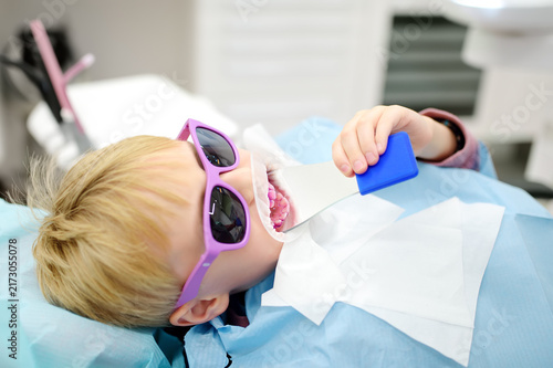 Konstfotografi A young patient at a dental hygienist appointment in a modern medical center