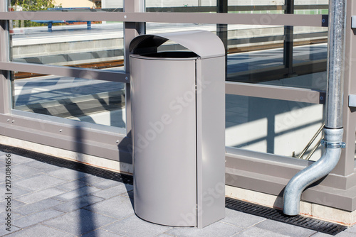 Outdoor Metal Trash Can at Railway Station Platform