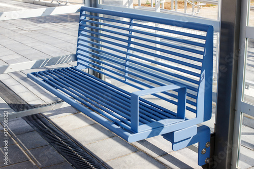 Modern Blue Metal Bench at Bus Stop or Railway Station Platform