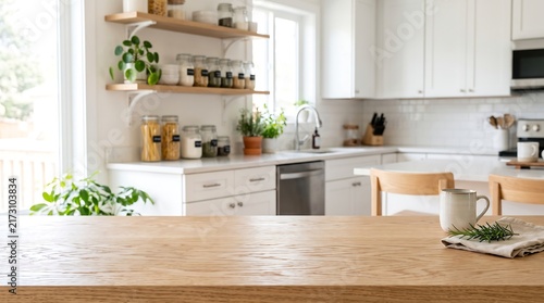 Empty wooden table top counter in bright modern white kitchen background for product display mockup and presentation