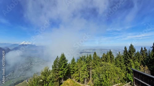Mountain Valley Covered by Low Clouds Above Green Forest