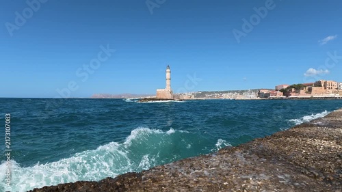 Waves crashing on the shore, as seen to the Chania lighthouse, Greece.