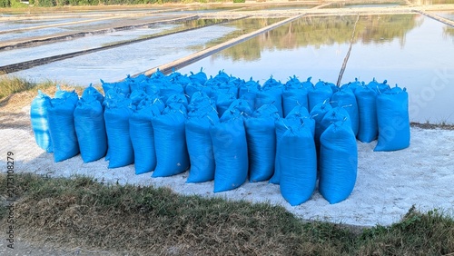 Принти на полотні Blue Sacks Of Salt On Fishpond Edge Salt Farming Harvest Rural