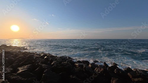 Waves crashing on the shore, as seen to the Chania lighthouse, Greece.