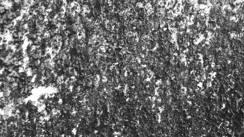 Weathered gray wall texture with scattered stains, porous details, and rough imperfections, suitable for monochrome backgrounds, grunge compositions, and overlays.