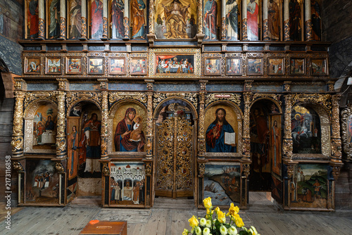 Obraz na plátně Intricate XVII century wooden iconostasis and ancient murals inside UNESCO Worl