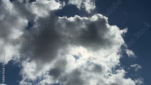 Dramatic Dark Cloud Backlit by Sunlight in the Sky

