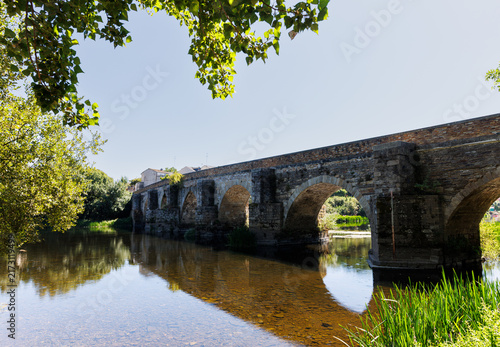 Ancient Roman stone bridge over Minho River in Lugo, Galicia,Spain