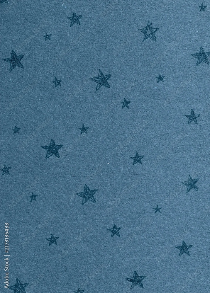Fototapeta premium Seamless pattern of small black stars on a light blue background. the stars are arranged in a repeating pattern, with each star having a unique shape and size.
