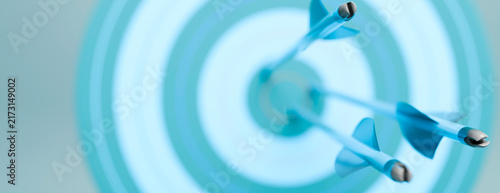 Foto Three arrows hitting the bullseye on a blue target, symbolizing success