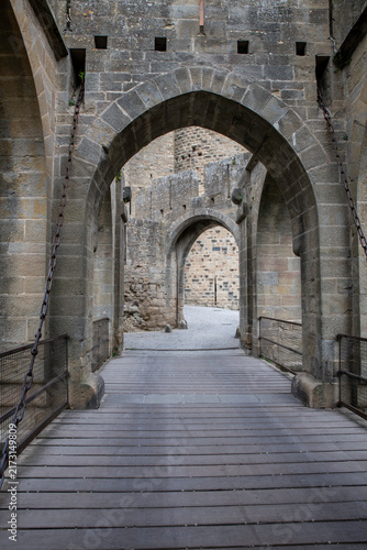 Medieval Stone Castle Archway Entrance With Wooden Drawbridge and Historic Gateway