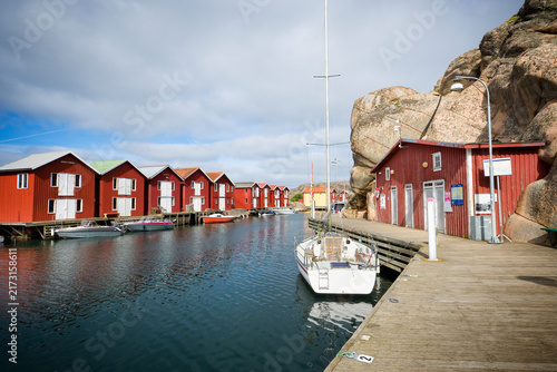 Red houses and a marina on the promenade Smögenbryggan in Smögen, Sweden
