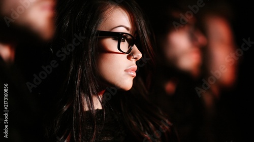 Cinematic portrait of a young woman wearing glasses