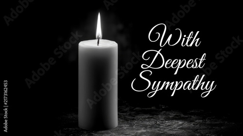 condolence card with burning candle and text with deepest sympathy