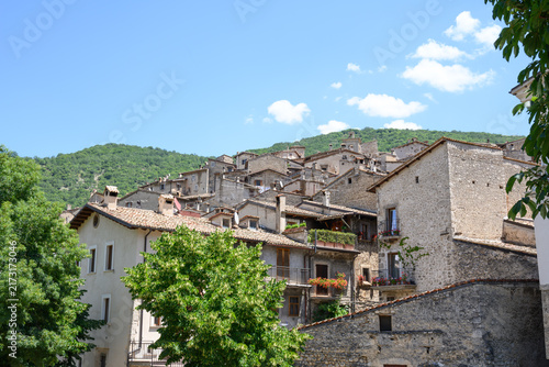 Фотография Sunny view of hillside stone houses in the historic town of Scanno Abruzzo Italy