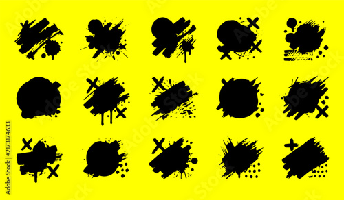 Black grunge brush stroke splash with splatter and crosses on yellow background
