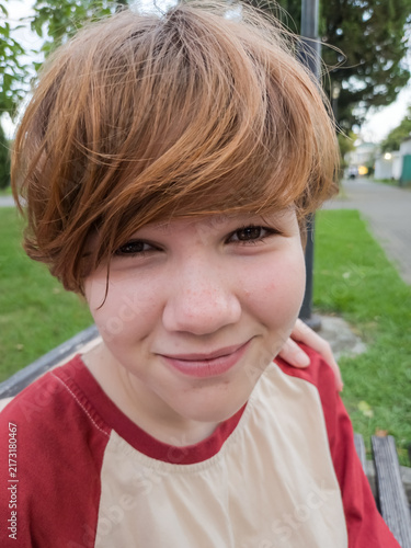Close Up Portrait of Smiling Teen with Freckles