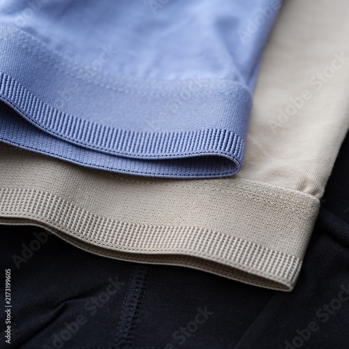 Foto A close-up shot of three pairs of mens jersey underwear garments in blue, beige,