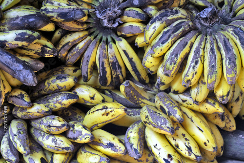 Ripe Spotted Bananas Stacked in Market Bunches Showing Natural Ripening and Texture