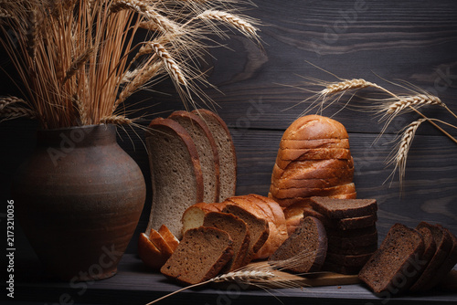 Bread rustic still life. Variety of sliced ​​rye and wheat breads