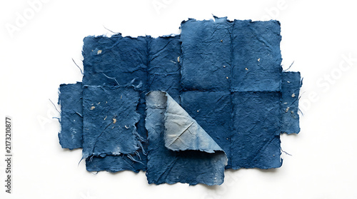 Stack of blue textured handmade paper sheets