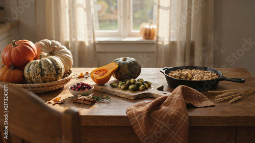 Cozy Autumn Thanksgiving Table with Pumpkins, Roasted Vegetables and Apple Crumble in Warm Natural Light
