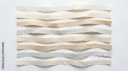 Set of horizontal torn paper strips with rough edges