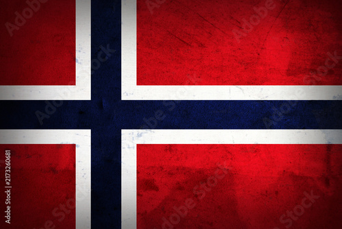 NORWAY Flag Grunge Background. National flag of NORWAY Grunge on rough metal texture with distressed surface, weathered effect, grain, scratches and aged details. Patriotic background for design.