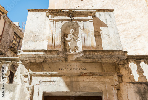 Ornate portal of the Church of the Guardian Angel in Palermo, Sicily, Italy, featuring an upper niche containing a marble statue