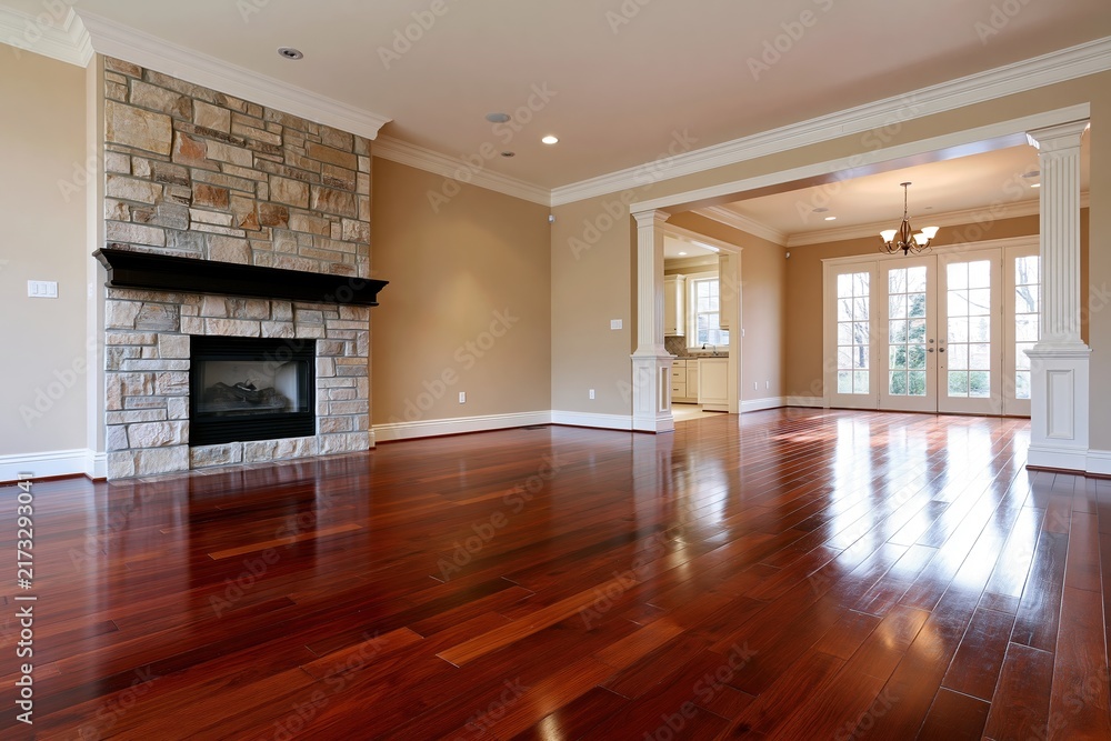 Obraz premium The Expansive Living Room with Stone Fireplace and Rich Hardwood Floors